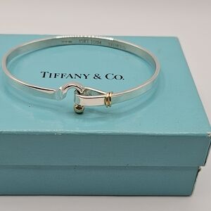Tiffany & Co sterling silver and 14k gold hook eye bangle